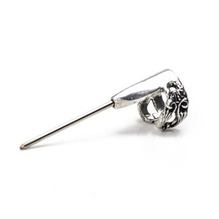 Slips onto your finger to use as a thread-laying tool