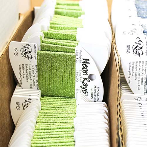Packages of Neon Rays Behind the scenes at the Rainbow Gallery factory