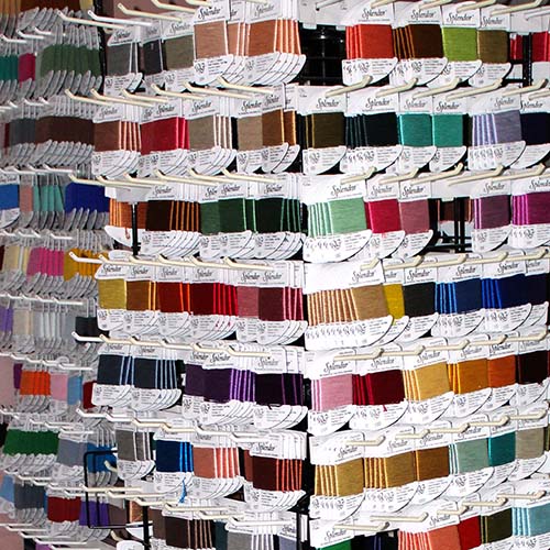 Rainbow Gallery threads on rack Behind the scenes at the Rainbow Gallery factory