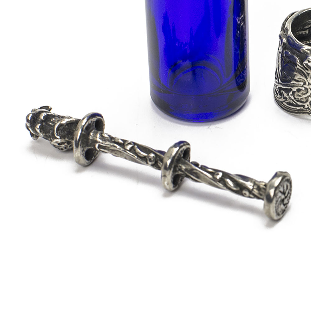Wrap thread around this pewter bobbin